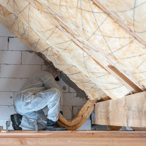 attic insulation being installed