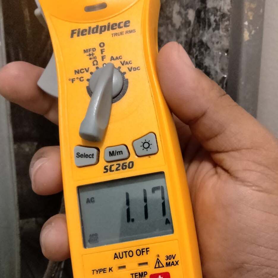Technician checks HVAC.