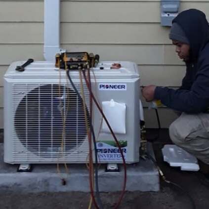 HVAC technician services AC.